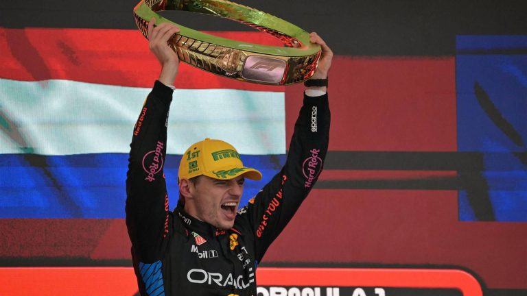 Red Bull Racing's Dutch driver Max Verstappen celebrates at the podium with the trophy of the Formula One Sao Paulo Grand Prix, at the Jose Carlos Pace racetrack, aka Interlagos, in Sao Paulo, Brazil, on November 3, 2024. 
NELSON ALMEIDA / AFP